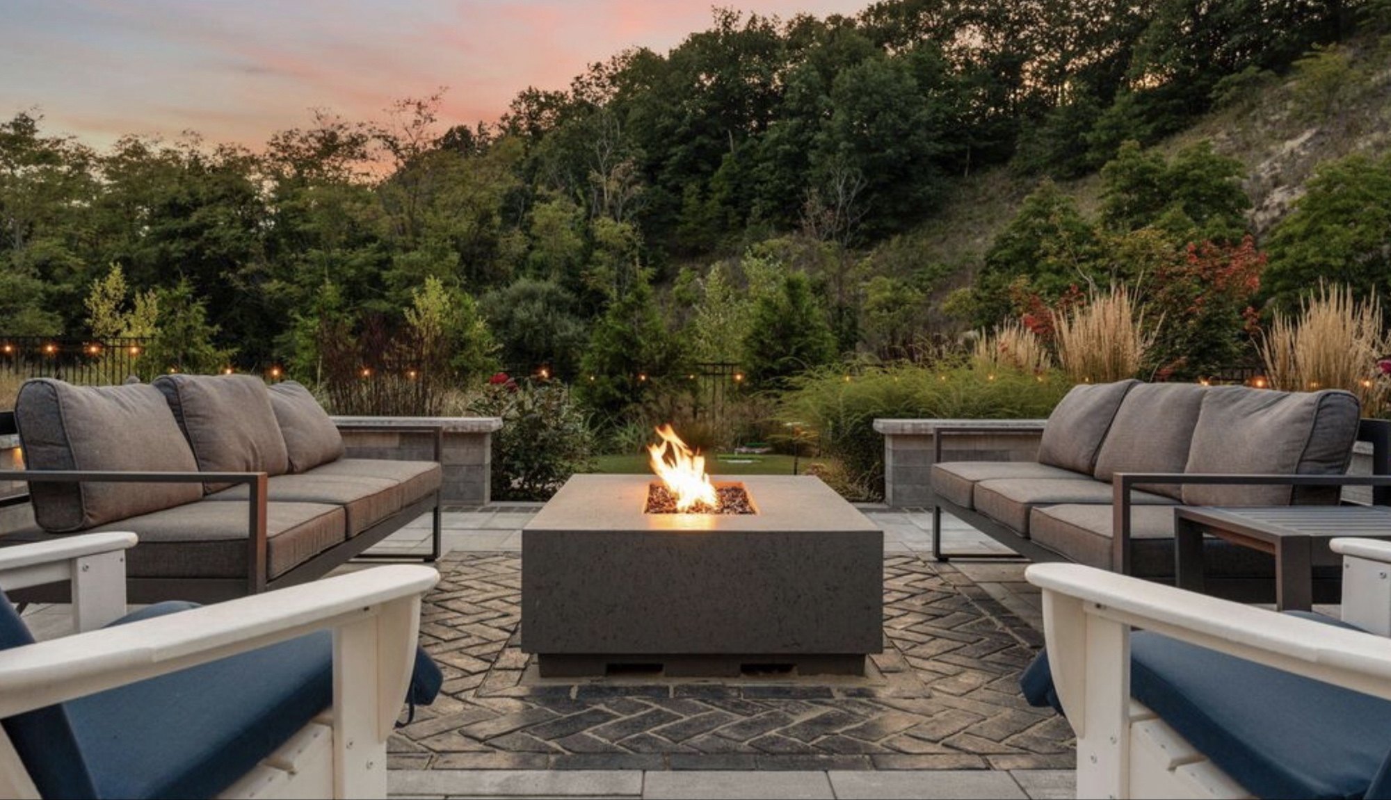 Stone fire terrace at sunset on a dunes-shoreline property